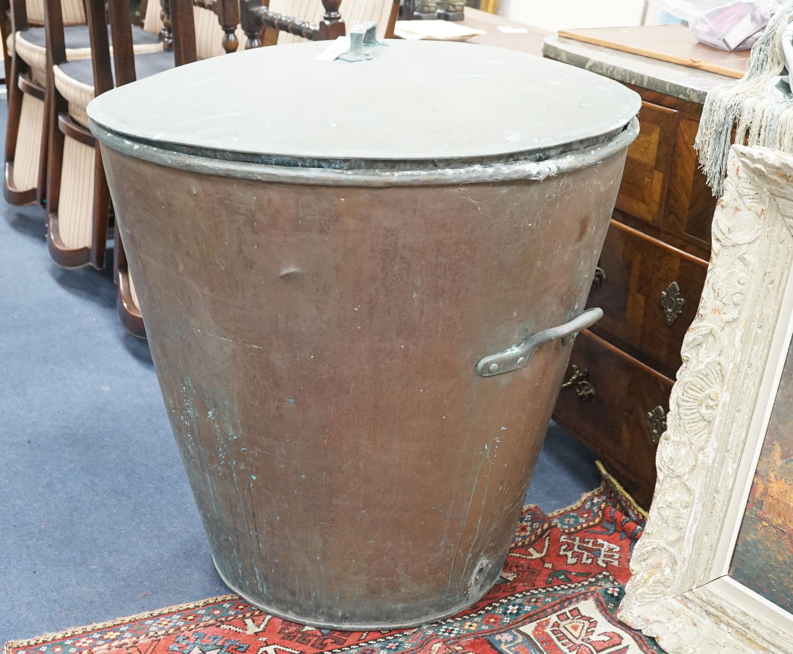 A large Victorian lidded copper vessel of tapering circular form, diameter 84cm, height 84cm